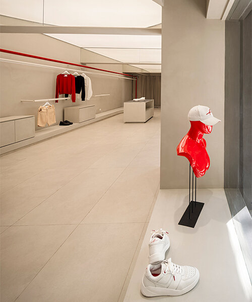 red sculptural elements define ARKS flagship store by anagram architects in mumbai