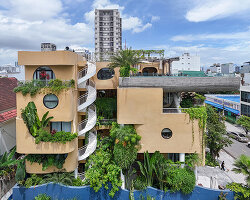 rooftop pool cantilevers from the facade of ho khue architects' hotel in vietnam