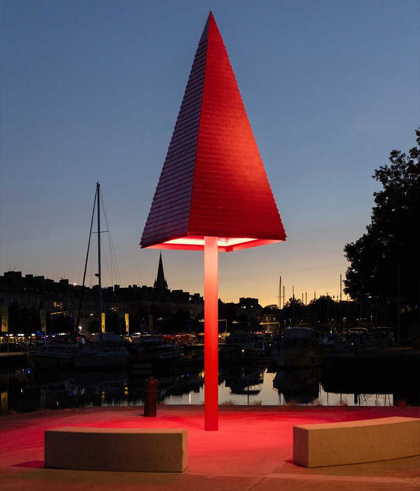 studio 5•5 rises 101st spire in caen as a glowing red monument to the city's millennium