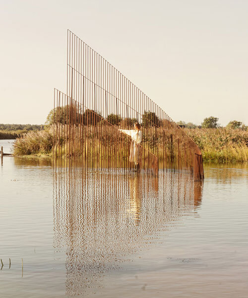 hundreds of vertical untreated steel rebars shape maetherea's kinetic installation in the UK
