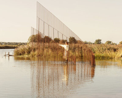 hundreds of vertical untreated steel rebars shape maetherea's kinetic installation in the UK