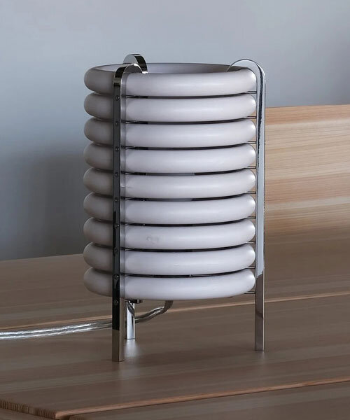 wa upcycled table lamp by akasaki & vanhuyse is crafted from retired tokyo train parts