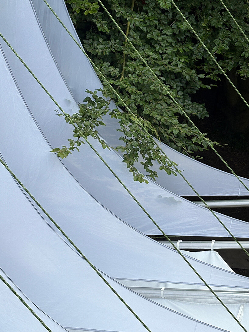 ZELT's curved rain-proof canopy ripples above dekmantel festival stage in the netherlands