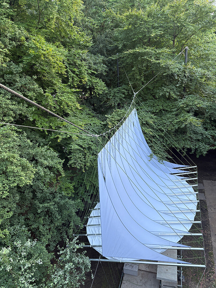 ZELT's curved rain-proof canopy ripples above dekmantel festival stage in the netherlands