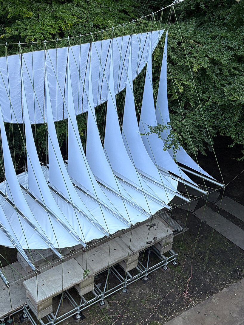 ZELT's curved rain-proof canopy ripples above dekmantel festival stage in the netherlands