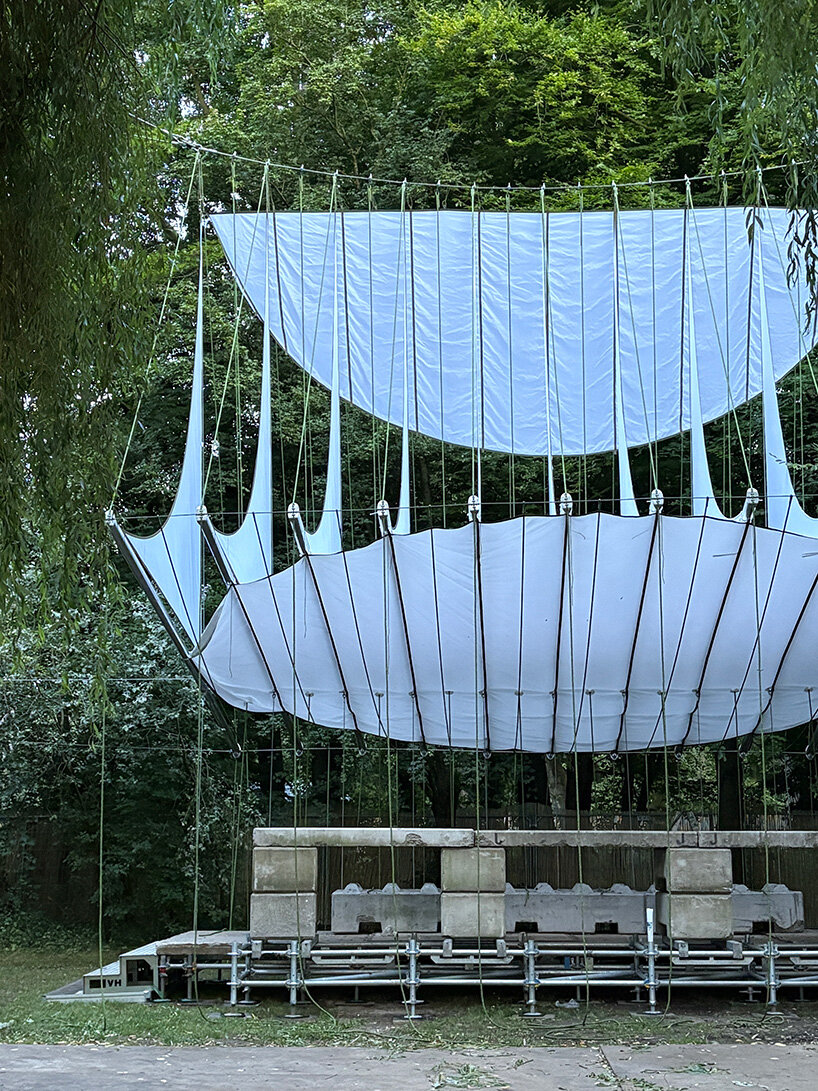 ZELT's curved rain-proof canopy ripples above dekmantel festival stage in the netherlands