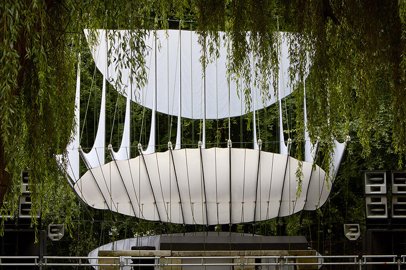 ZELT's curved rain-proof canopy ripples above dekmantel festival stage in the netherlands