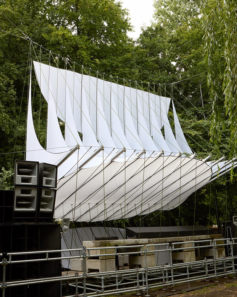 ZELT's curved rain-proof canopy ripples above dekmantel festival stage in the netherlands