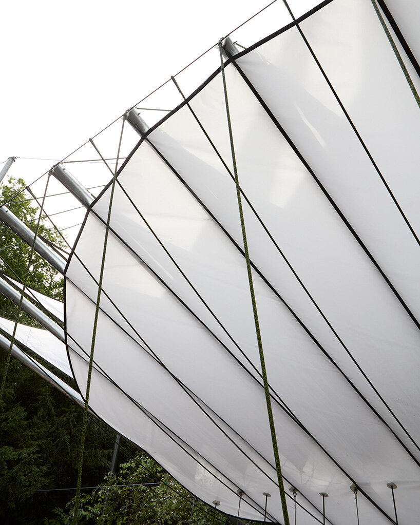 ZELT's curved rain-proof canopy ripples above dekmantel festival stage in the netherlands
