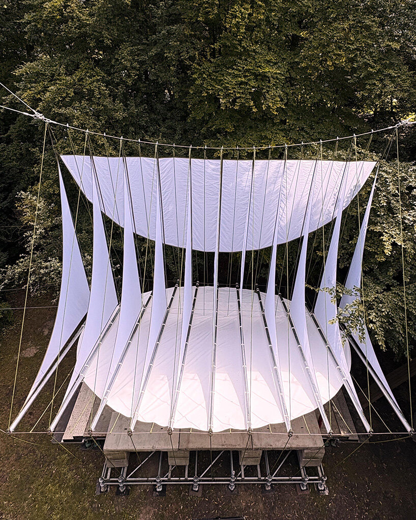 ZELT's curved rain-proof canopy ripples above dekmantel festival stage in the netherlands