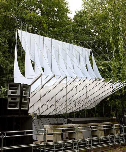 ZELT's curved rain-proof canopy ripples above dekmantel festival stage in the netherlands