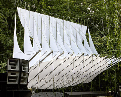 ZELT's curved rain-proof canopy ripples above dekmantel festival stage in the netherlands
