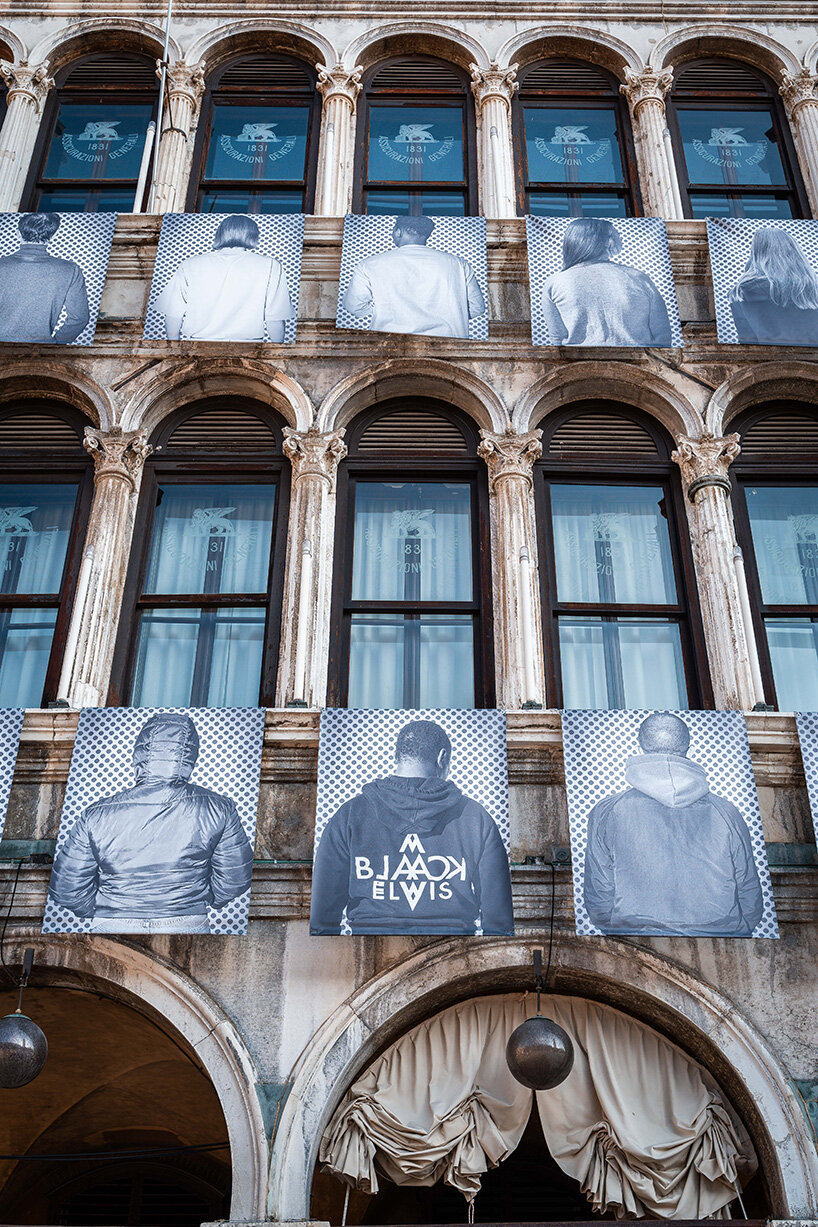 100 large-scale migrant portraits transform venice's iconic procuratie facade