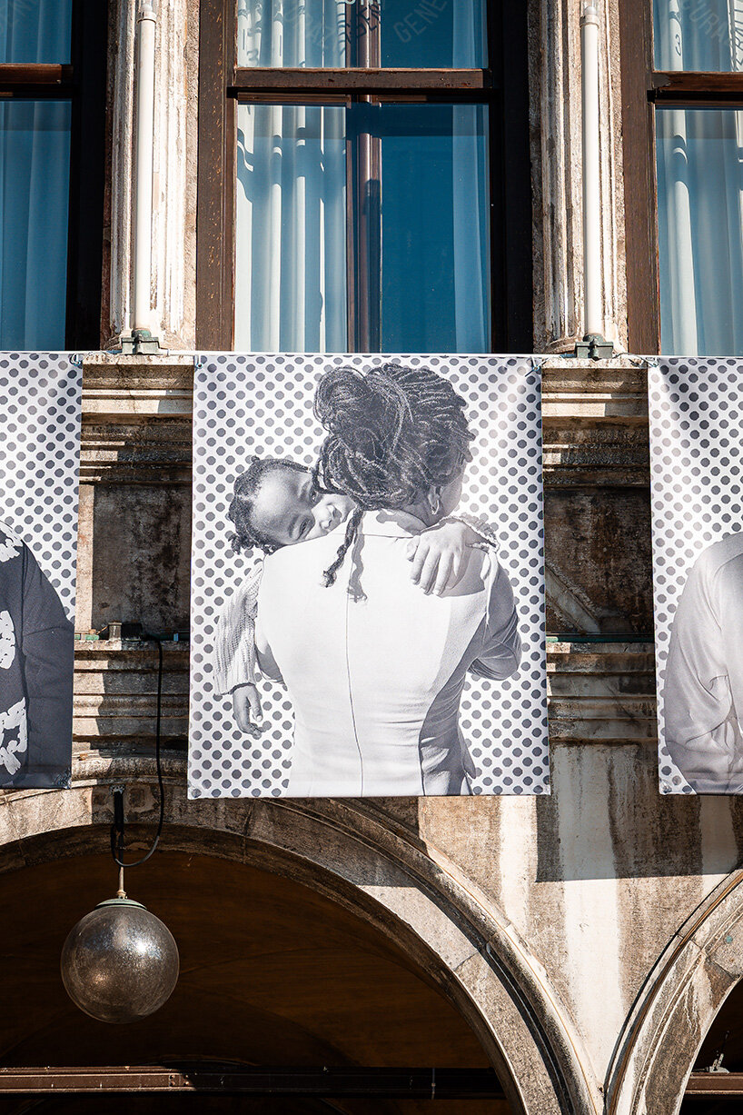 100 large-scale migrant portraits transform venice's iconic procuratie facade