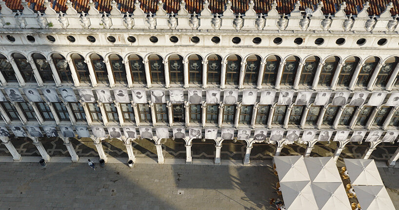 100 large-scale migrant portraits transform venice's iconic procuratie facade