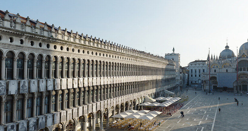 100 large-scale migrant portraits transform venice's iconic procuratie facade
