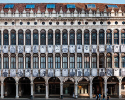 100 large-scale migrant portraits transform venice's iconic procuratie facade