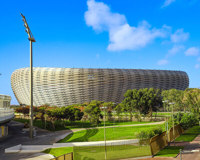 19,200 golden triangles compose luminous facade of populous' stadium in morocco
