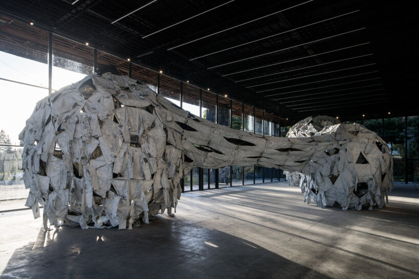 the camouflage clothing interprets the ongoing conflict outside of the pavilion