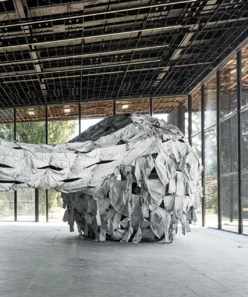 ai weiwei’s installation in ukraine unveils proportioned spheres & dyed camouflage uniforms