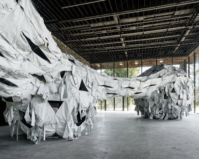 ai weiwei’s installation in ukraine unveils proportioned spheres & dyed camouflage uniforms