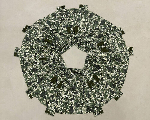 Three Perfectly Proportioned Spheres and Camouflage Uniforms Painted White