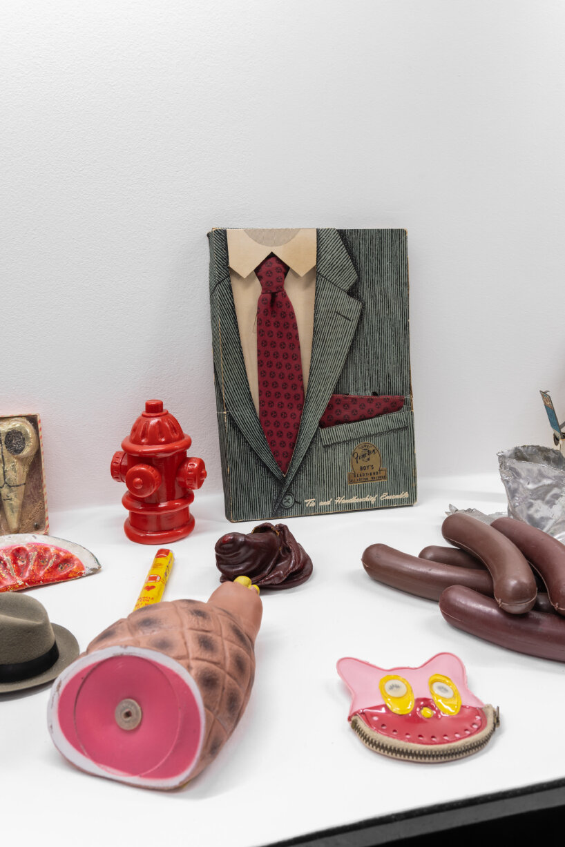 the similarities between the two installations occur in amassing and presenting mass-produced and pop-culture objects