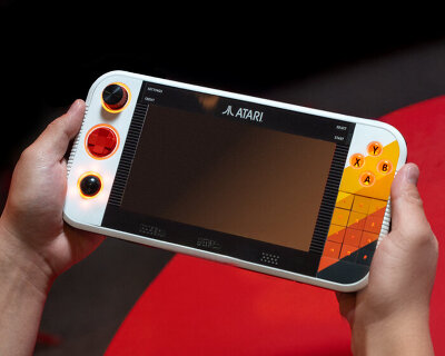 atari gamestation go revives retro gaming with glowing buttons, numeric keypad & trackball