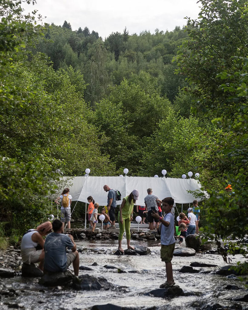 ephemeral circle textile installation by atelier VRAC activates mountain river in romania