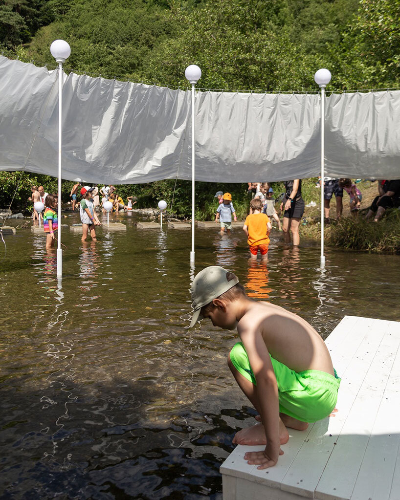 ephemeral circle textile installation by atelier VRAC activates mountain river in romania