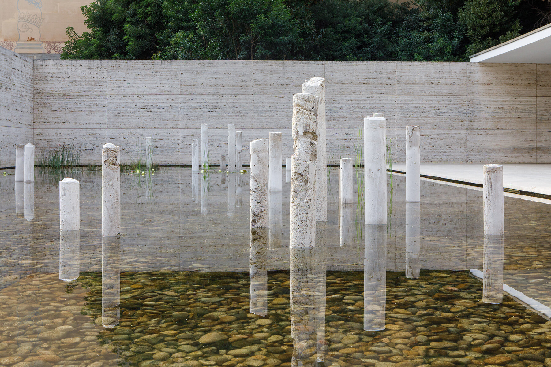 concrete-sculptures-surface-pond-mies-van-der-rohe-barcelona-pavilion-designboom-large01