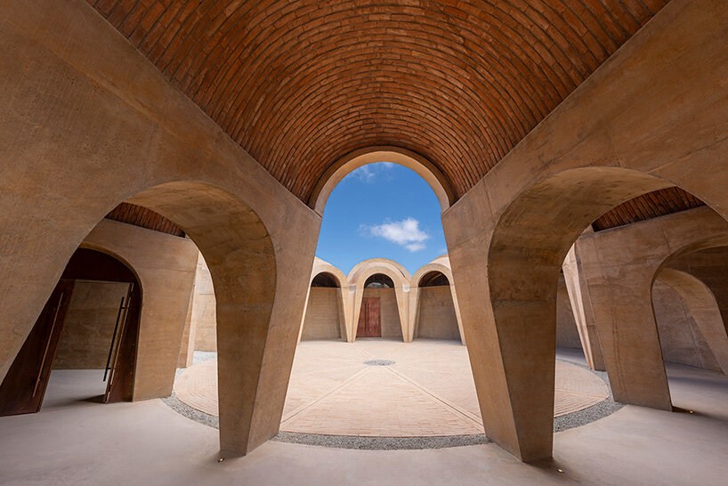 concrete walls shape circular 'pictograma' winery around rain-harvesting courtyard in mexico