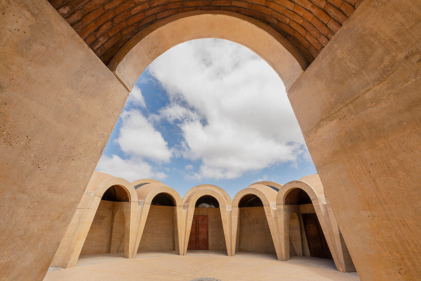 concrete walls shape circular 'pictograma' winery around rain-harvesting courtyard in mexico