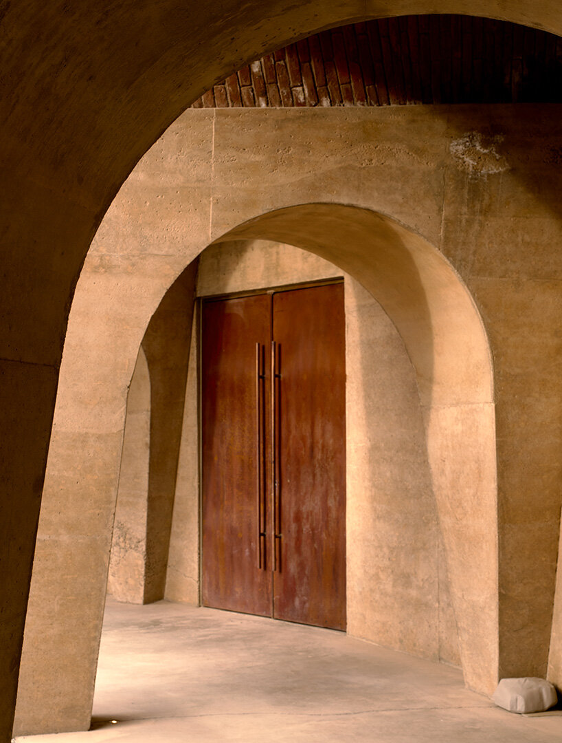 concrete walls shape circular 'pictograma' winery around rain-harvesting courtyard in mexico