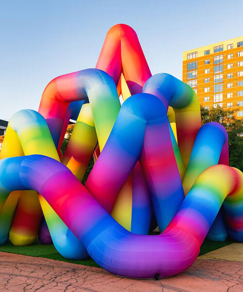 intertwined tubular forms shape inflatable rainbow labyrinth by cyril fancelin in grand rapids