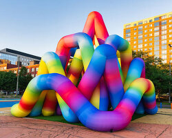 intertwined tubular forms shape inflatable rainbow labyrinth by cyril fancelin in grand rapids