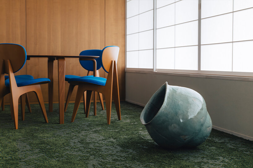 hakusen revitalizes modernist city hall into boutique hotel and public library in japan