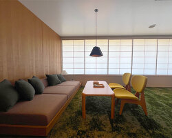 hakusen revitalizes modernist city hall into boutique hotel and public library in japan