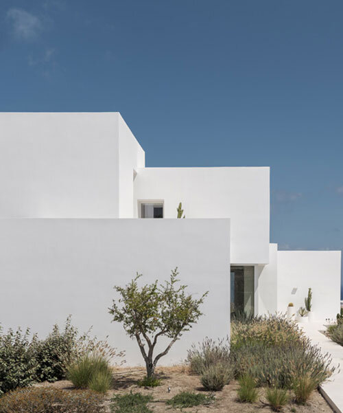 house in oia by kapsimalis architects embeds white prisms along greek volcanic landscape