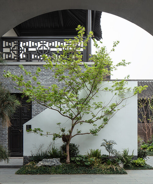 B.L.U.E. architecture studio converts historic chinese cinema into 'jiangnan house' hotel