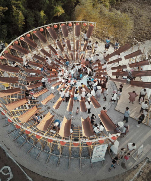 ladders turn into circular framework for climbing amphitheater in rural chinese town