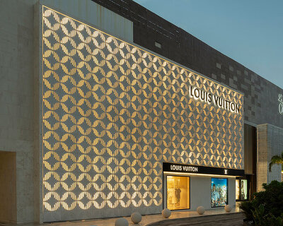louis vuitton's cancun boutique unveils concrete facade with sculpted flower motif