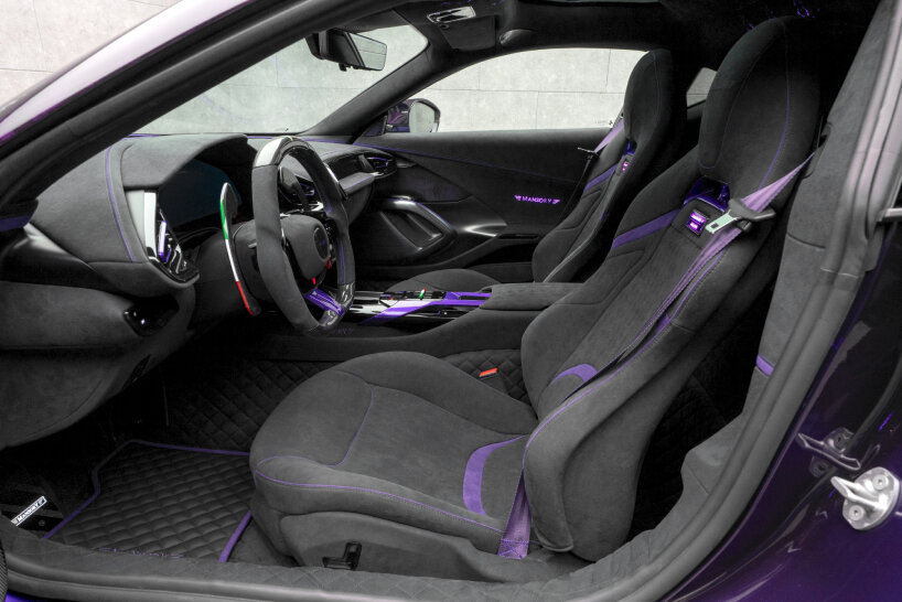 the full interior is covered in grey Alcantara, combined with purple accents on the seats