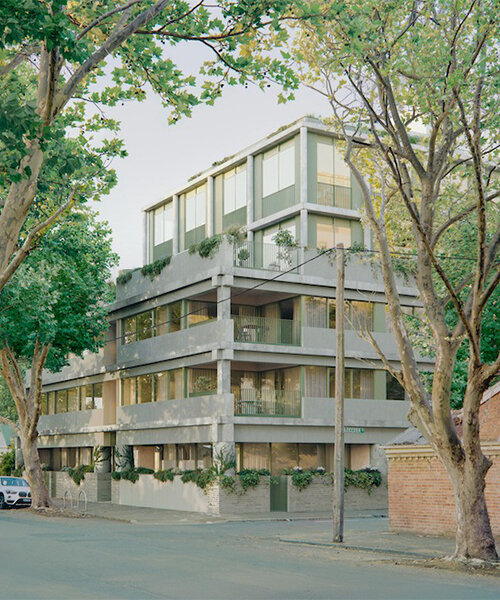 monolithic apartment complex contrasts with verdant fitzroy streetscape in melbourne
