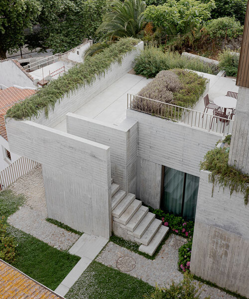 renovated porto residence reimagines hillside terraces with stepped concrete layers
