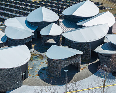 gabion walled-pavilion surrounds biodiverse courtyard at expo 2025 osaka
