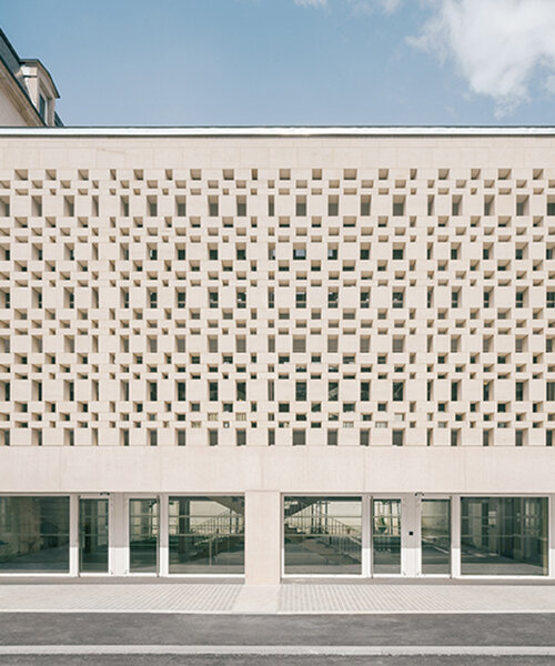 perforated stone gallery by agence vulcano-gibello connects law faculty buildings in france