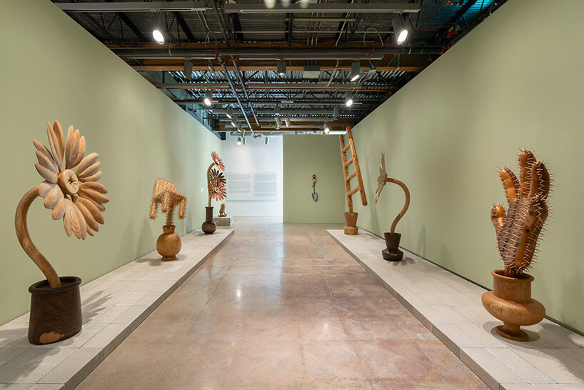 raul de lara carves surreal wooden sculptures to question who gets to belong