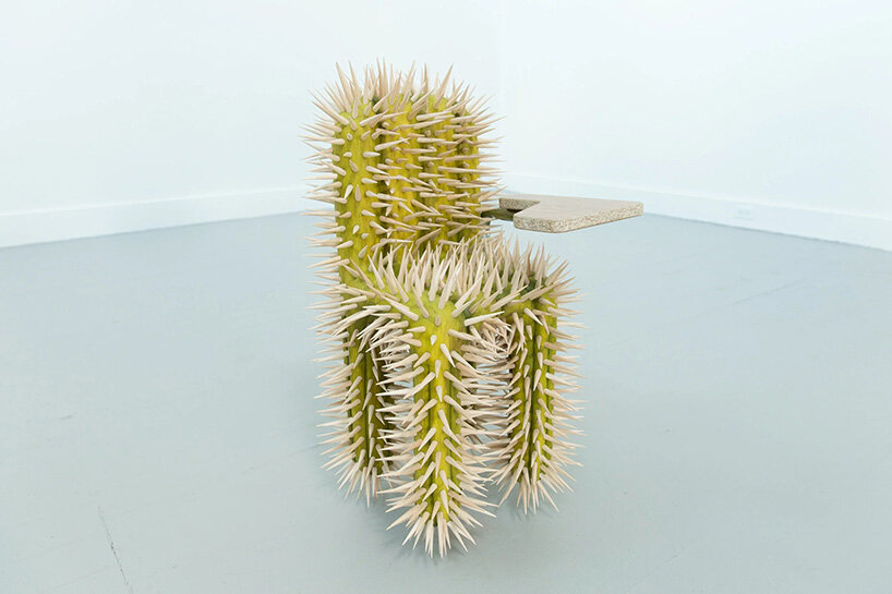 raul de lara carves surreal wooden sculptures to question who gets to belong