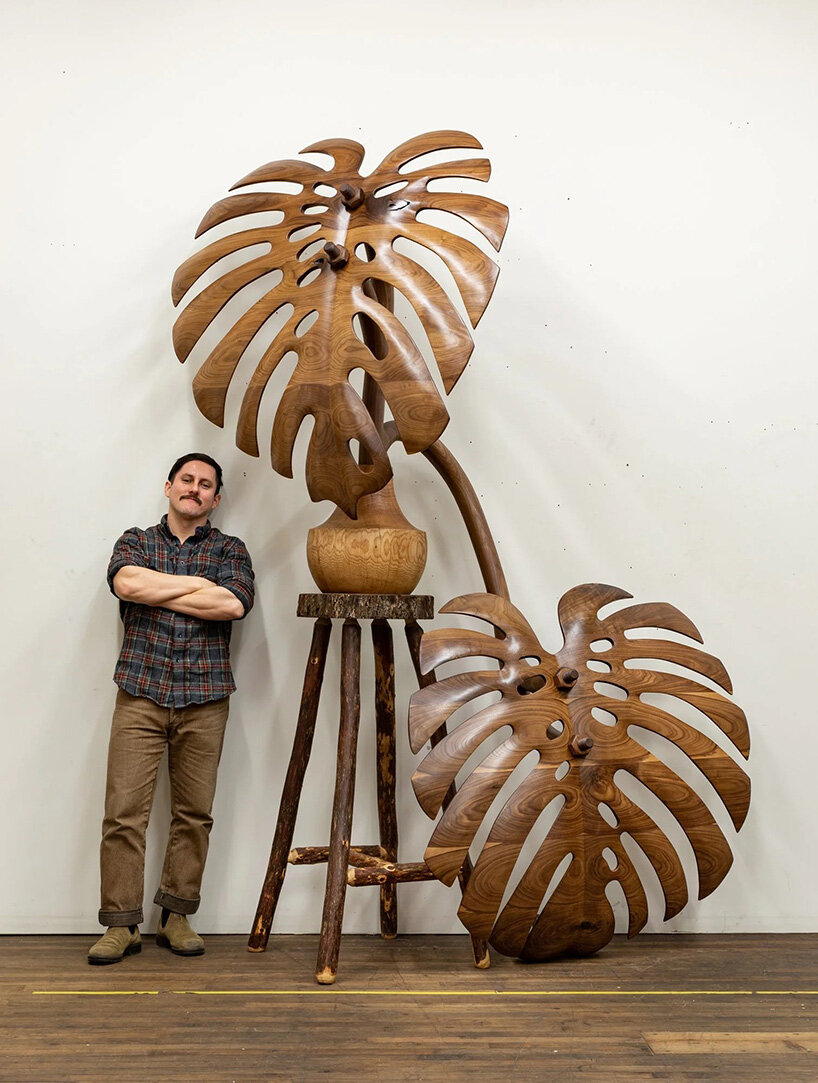 raul de lara carves surreal wooden sculptures to question who gets to belong